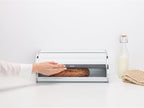 Brabantia Roll Top Bread Box | Large | White | Metal Front Opening Bread Store for Kitchen Countertop | Partly Flat Top for Extra Storage, Magnet Closing Lid | Fits 2 Loaves