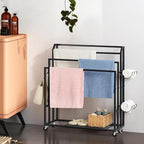 Towel Rack for Bathroom Freestanding Towel Holder Stand Black Blanket Holder for Floor Large Towel Cart with Wheels, Storage Shelves, 6 Metal Hooks for Bathroom, Pool, Living Room