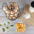 QUTREY Black Metal Egg Holder Countertop, Fresh Egg Skelter, Spiral Design Egg Dispenser Rack with Storage Basket for Display Easter Eggs