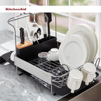 KitchenAid Compact to Full Size Expandable, Rust Resistant Satin Coated Dish Rack with Angled Self Draining Drain Board and Removable Flatware Caddy, 24-Inch, Charcoal
